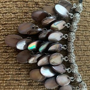 Lia Sophia black cord and oval brown beads.   So fun with a simple T-shirt!